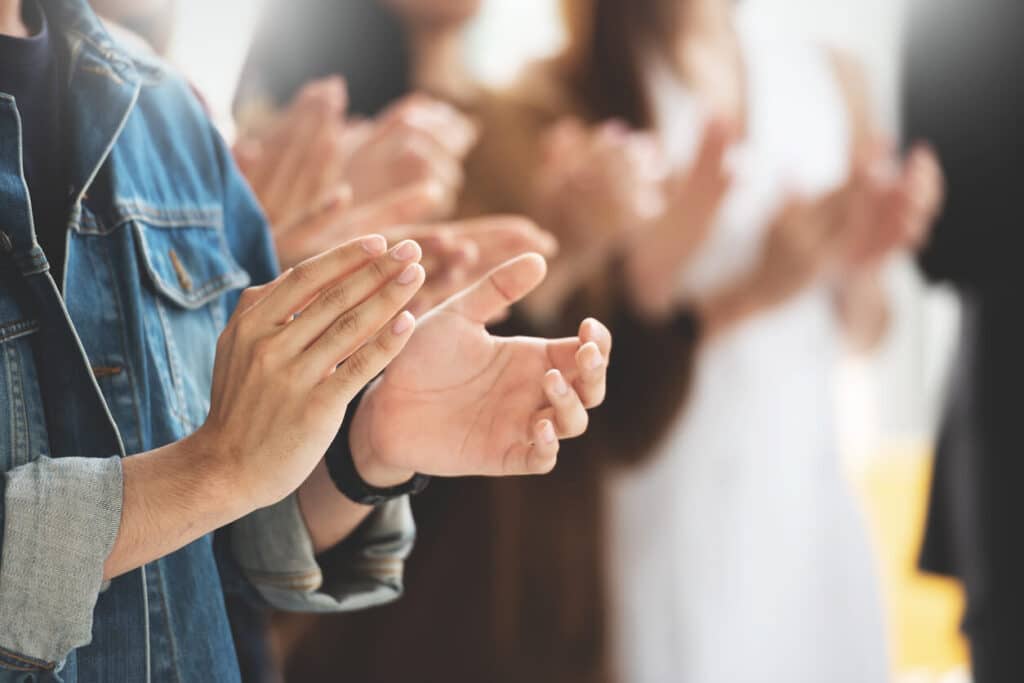 women clapping
